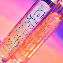 Lottie Shimmer Lip Glaze - Be Proud 24 Lottie Shimmer Lip Glaze - Be Proud -Costetic Make-up Store Lottie Pride Collection 2023 Shimmer Lip Glaze Group 3
